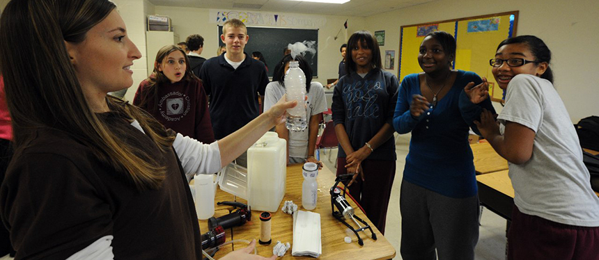 diverse group of high school students in a lab with instructor