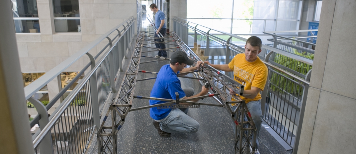 students working on a bridge