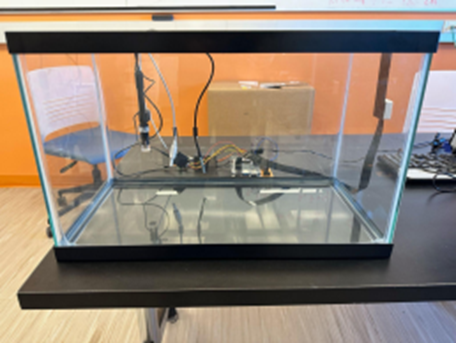 two students viewing water experiment in a lab