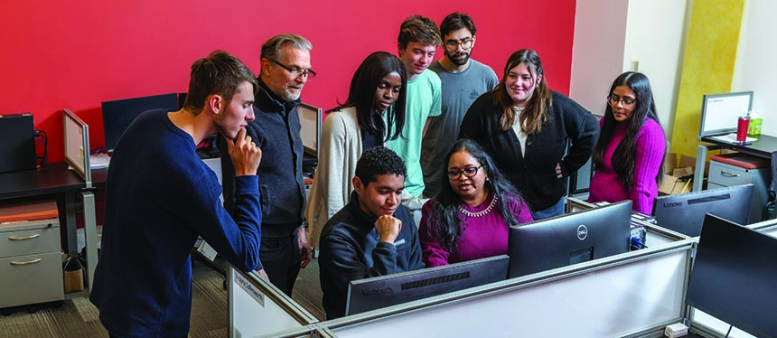 Standing (left to right) are   Brendan Weil, Dr. Robert Hesketh, Harriet Appiah, Matthew Conway, Milo Barkow, Marcella McMahon, and Jahnvi Patel. Sitting (left to right) are Andres Castellar and Dr. Kirti Yenkie.