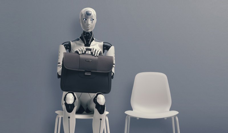 robot sitting on chair next to an empty chair