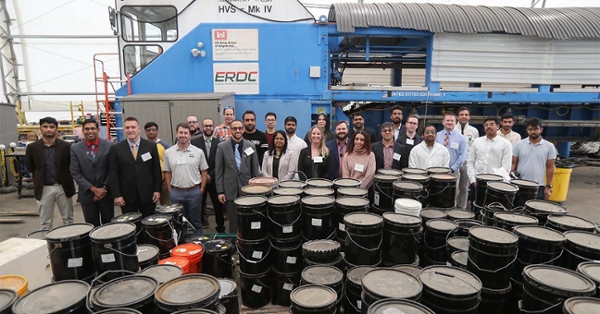 In this 2023 file photo, research engineers from the U.S. Army Engineer Research and Development Center stand with researchers at Rowan University's Center for Research & Education in Advanced Transportation Engineering Systems at a testing facility on the West Campus.