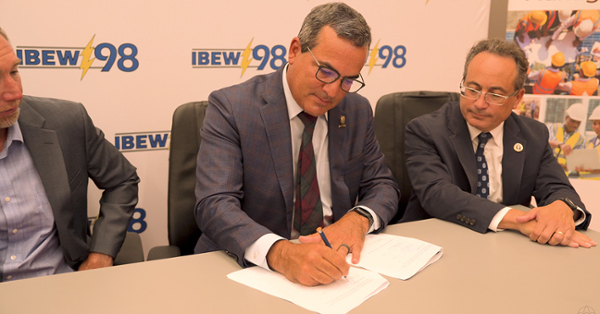 From left, IBEW Local 98 President Jim Foy, Rowan University Provost Tony Lowman and Henry M. Rowan College of Engineering Dean Giuseppe Palmese sign an agreement Wednesday.