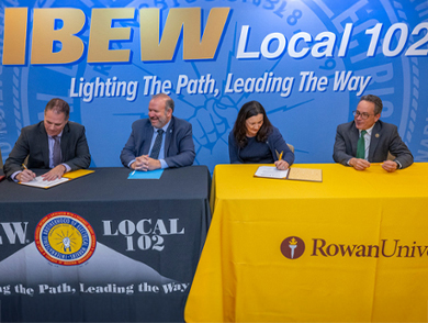 From left, Bernie Corrigan, president of IBEW Local 102; New Jersey Department of Labor and Workforce Development Commissioner Robert Asaro-Angelo; Lorraine Ricchezza, associate provost for academic strategic initiatives at Rowan University; and Giuseppe R. Palmese, Ph.D., dean of the Henry M. Rowan College of Engineering, at Friday’s signing of an agreement expanding educational opportunities for union members. 