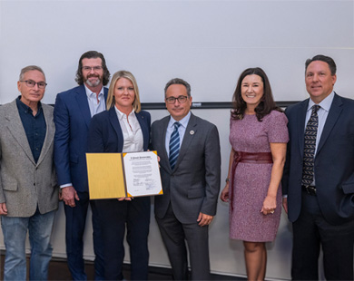 Leaders from Rowan University, IUPAT District Council 21 and the Finishing Trades Institute of the Mid-Atlantic Region pose in Philadelphia on Nov. 4 after signing a ceremonial document marking their new partnership.