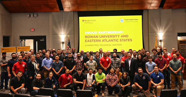 Apprentices pose for a group photo with officials from Eastern Atlantic States Carpenters Technical Centers and Rowan University at a signing ceremony in Edison on Friday, Nov. 8.